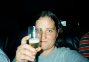 A particularly shocking looking Emily makes a toast to New York